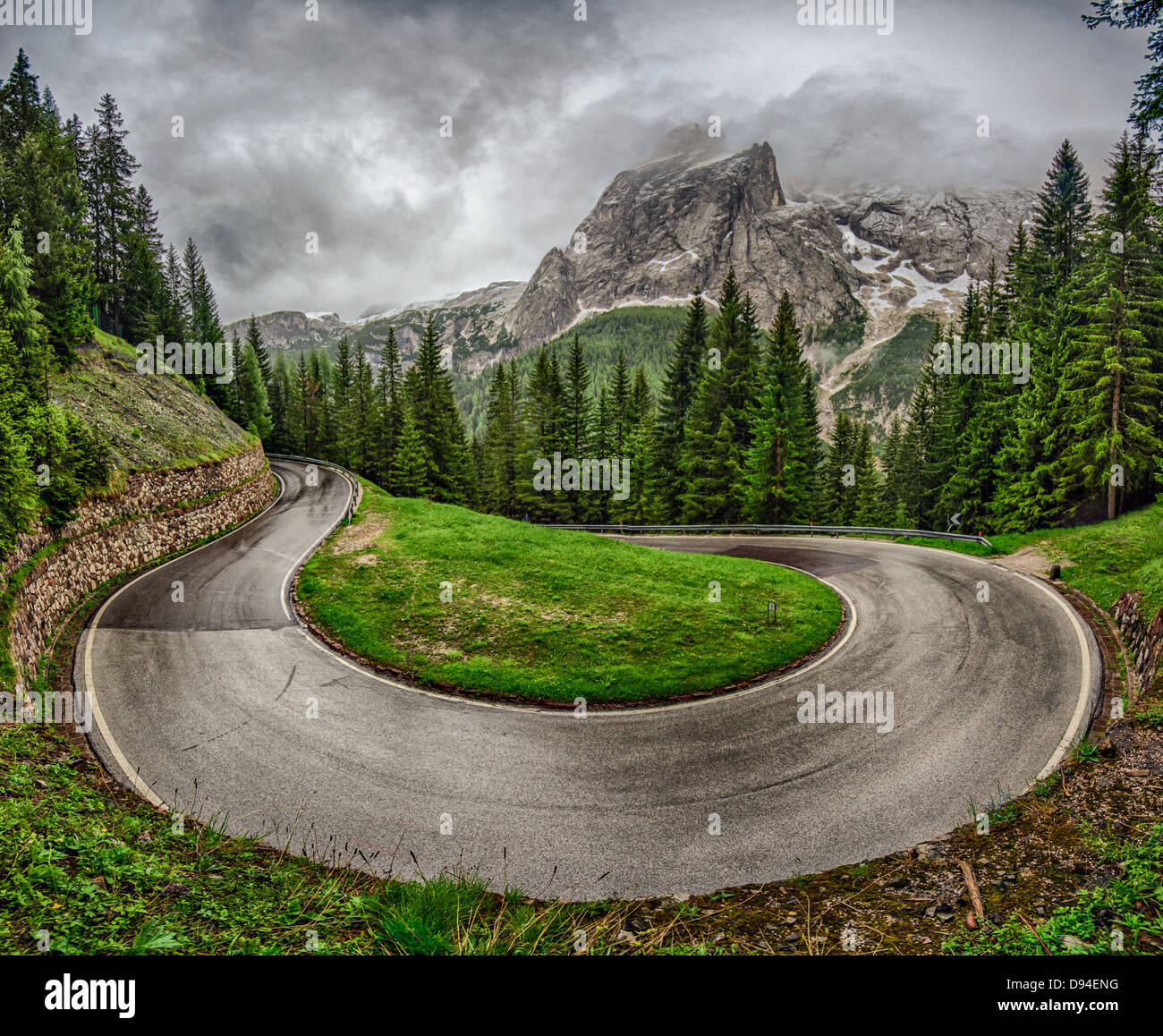 a view of a dangerous road bend in italian alps (color Stock Photo - Alamy