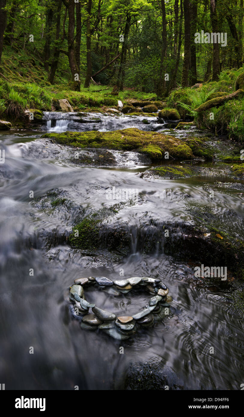 Heart Shape Pebble sculpture in Venford brook, Dartmoor, Devon Stock Photo