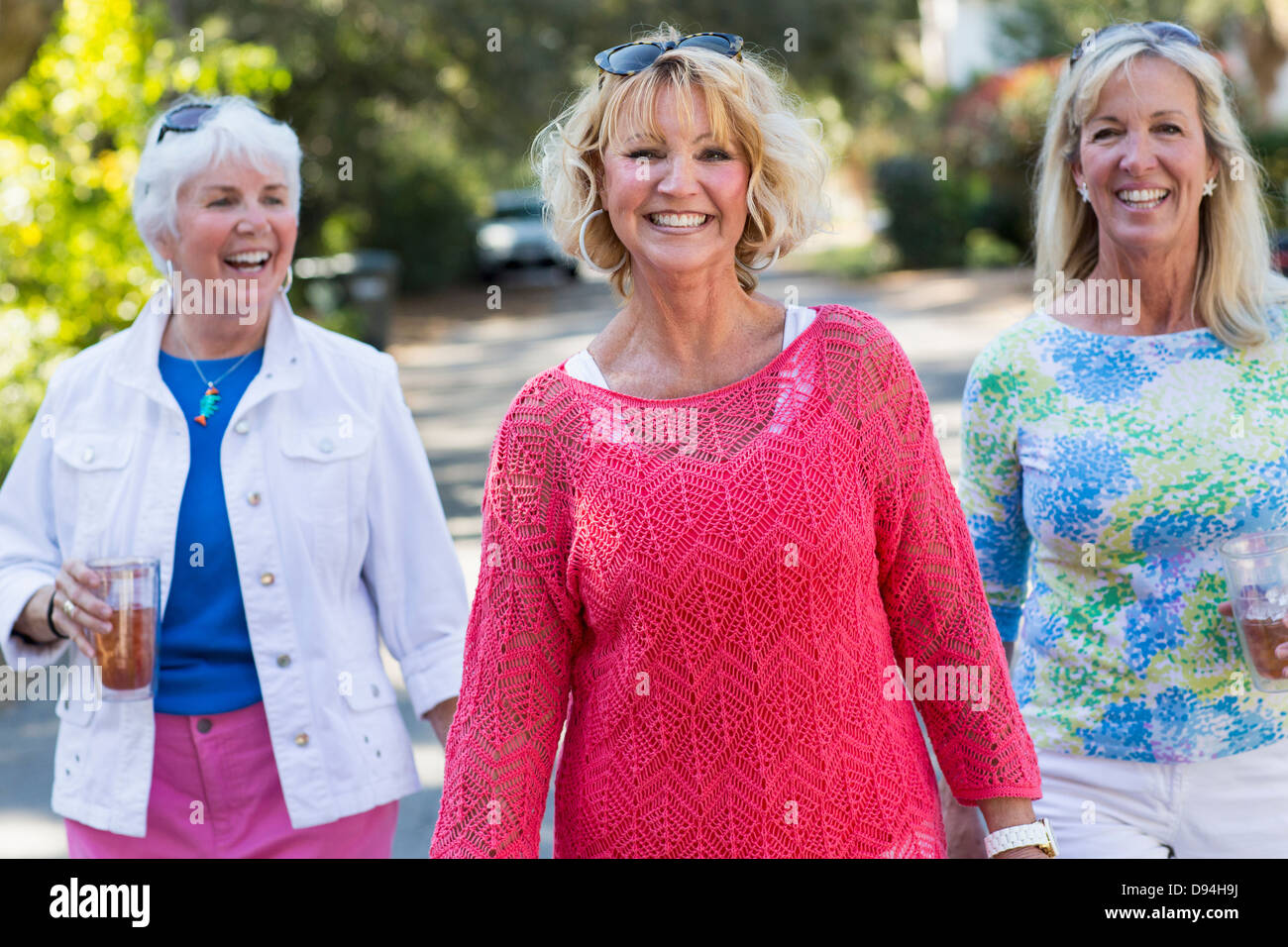 Mature woman walking on street hi-res stock photography and images - Alamy