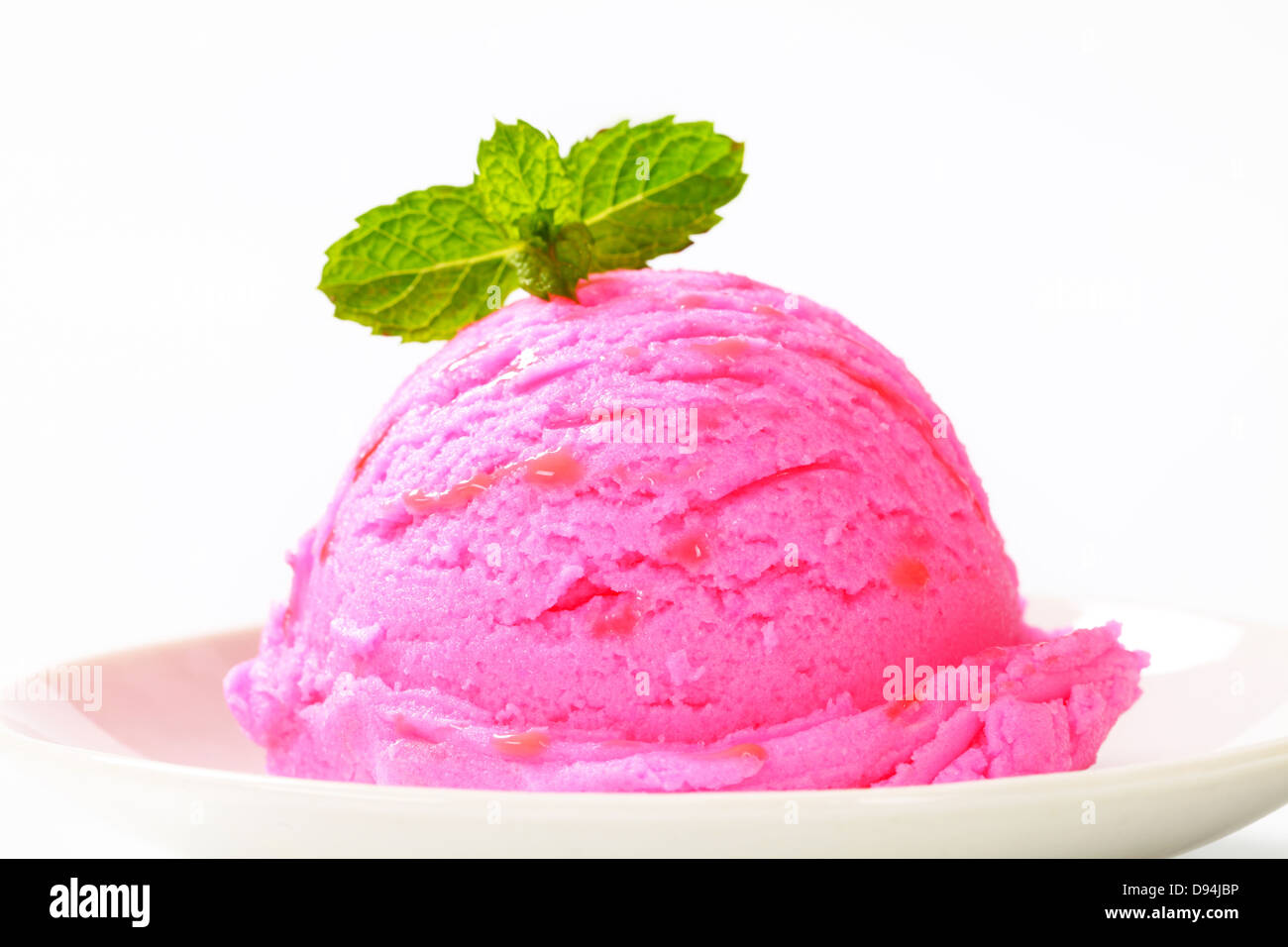 Scoop of pink ice cream on a dessert plate Stock Photo