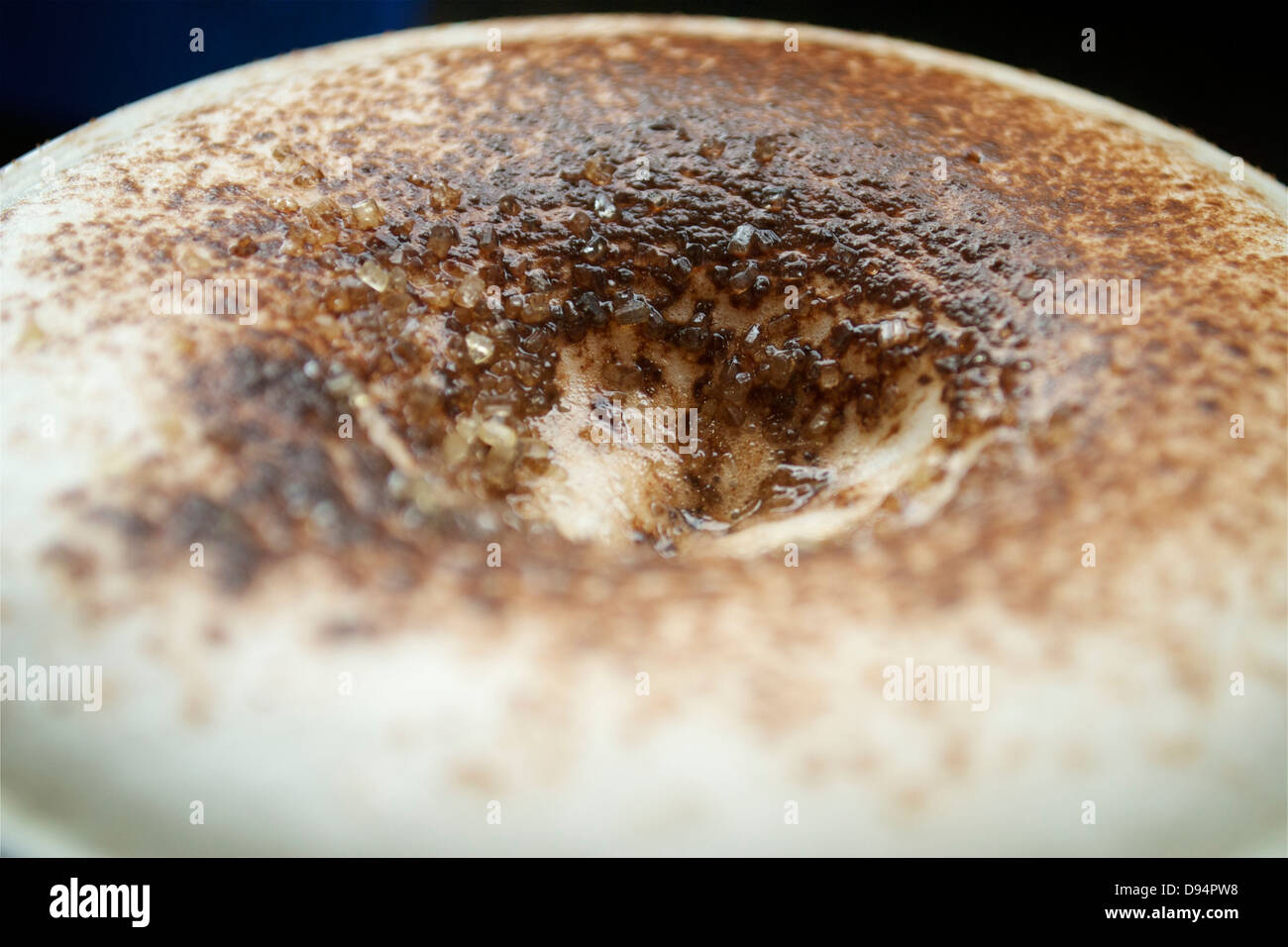 Sugar melting into froth of a cappuccino Stock Photo