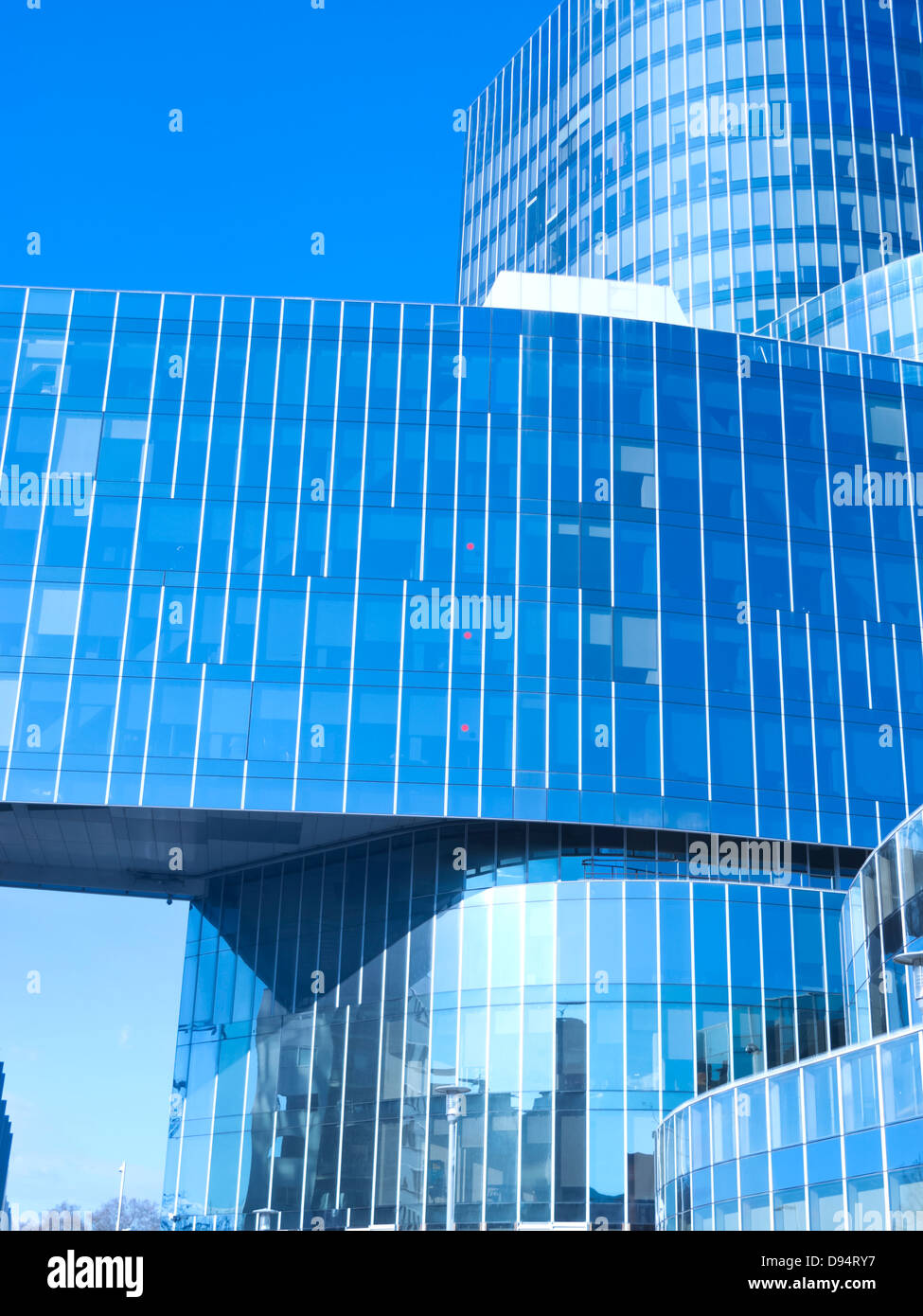 Modern office building with blue glass facade futuristic Stock Photo ...