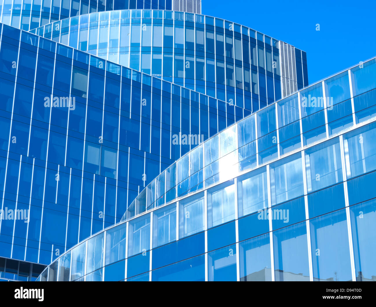 Modern office building with blue glass facade futuristic Stock Photo ...
