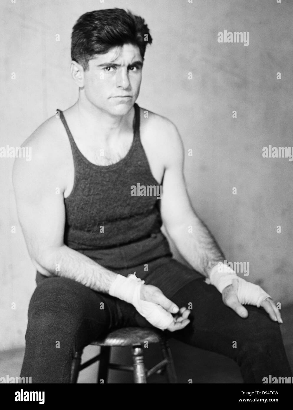 Vintage photo of Argentinian boxer Luis Angel Firpo (1894 – 1960). Firpo, known as “The Wild Bull of the Pampas”, famously challenged champion Jack Dempsey for the world heavyweight title in a dramatic slugfest in 1923 in which he knocked / pushed Dempsey out of the ring in the first round before getting knocked out by Dempsey in the second round. Stock Photo