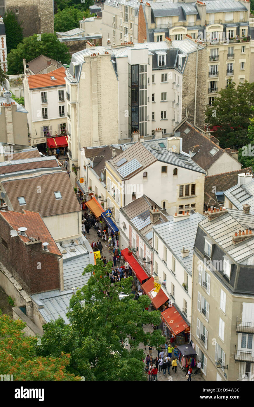 Busy Parisian street from above with colourful canopies Stock Photo