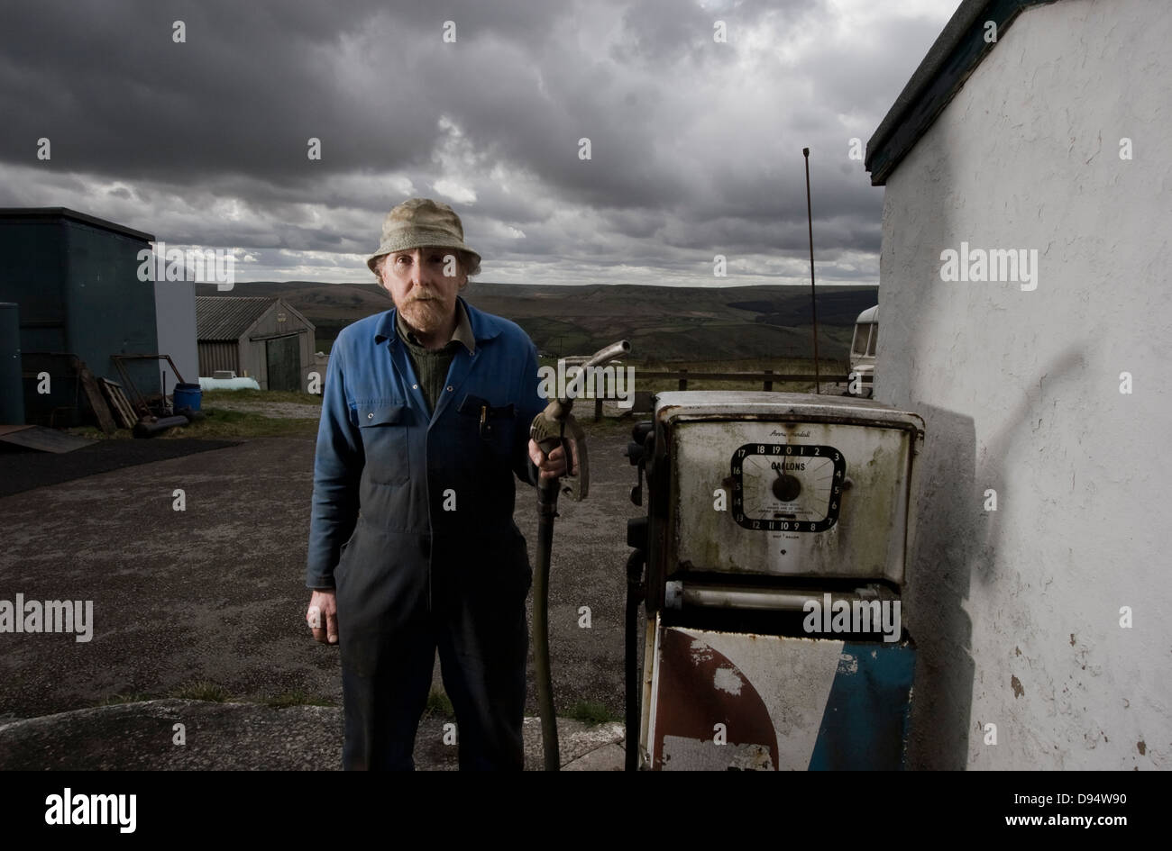 Motor engineer at Blackshaw Head near Hebden Bridge , West Yorkshire at the petrol pump Stock Photo