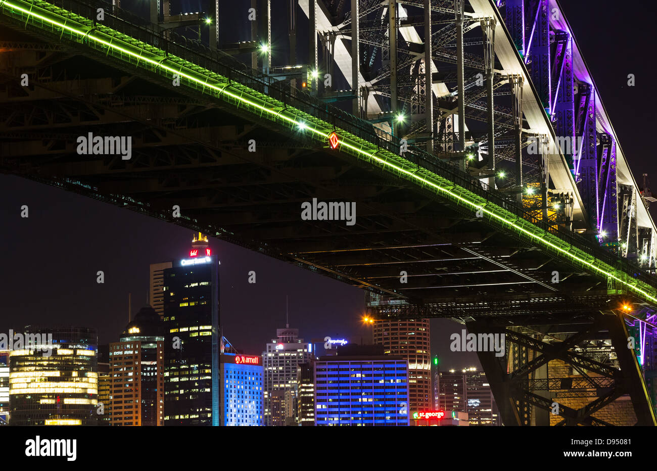 Skyscrapers viewed from under the Sydney Harbour Bridge at night, Sydney, Australia Stock Photo