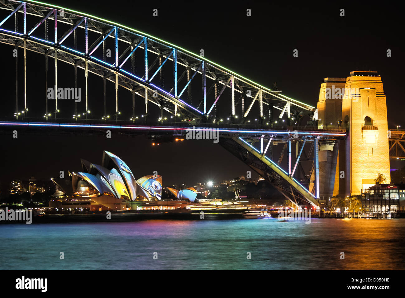 Sydney Harbour Bridge and Sydney Opera House at night during the annual Sydney Lighting Festival Vivid Stock Photo