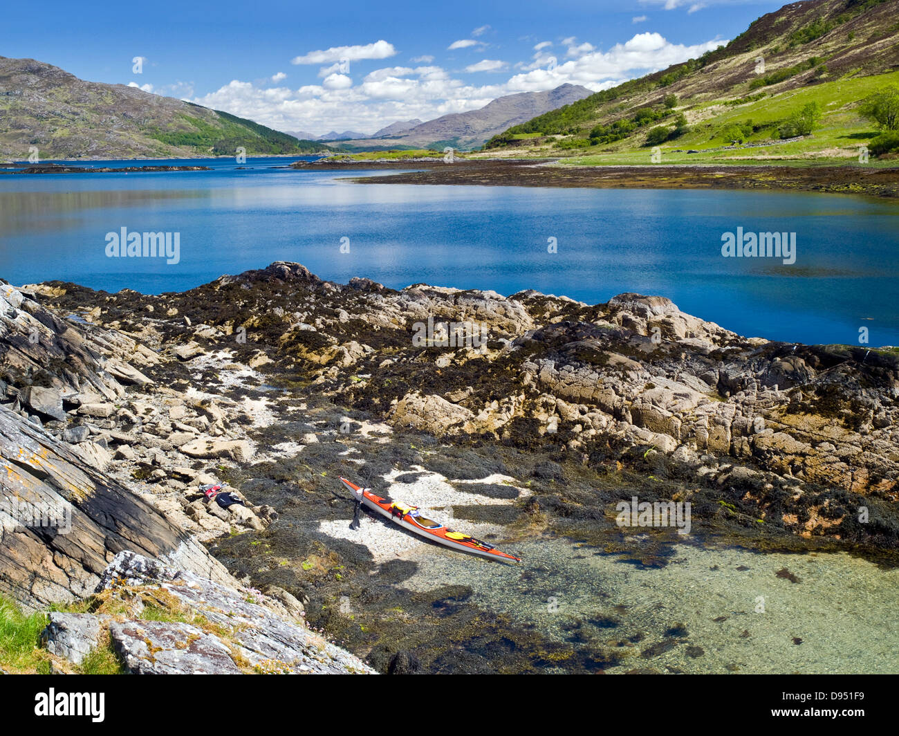 The island of Carna, Loch Sunart, Scotland with sea kayak on beach Stock Photo