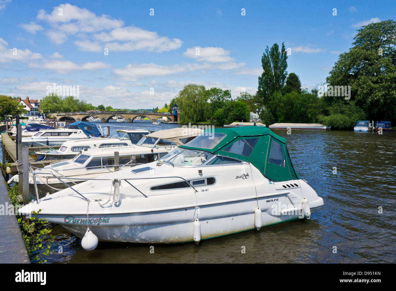 Henley-on-Thames Motorboats moored by the side of the river Thames at Henley-on-Thames Oxfordshire England UK GB  Europe Stock Photo