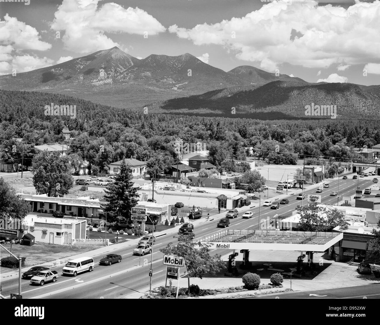 A view looking north of Milton Avenue in Flagstaff, Arizona. The San Francisco Peaks dominate the skyline. Stock Photo