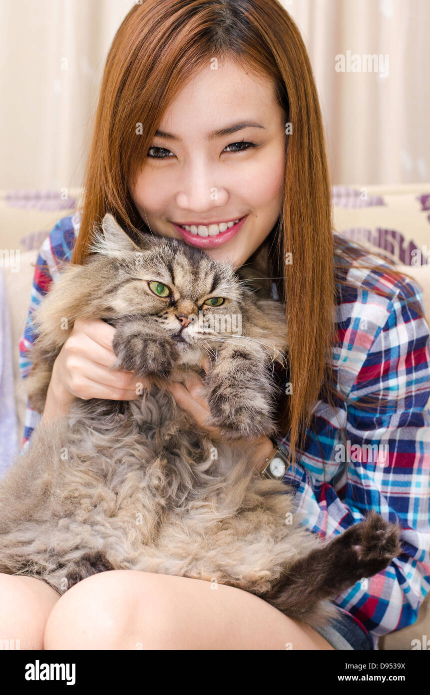 Thai girl with a cat. Stock Photo