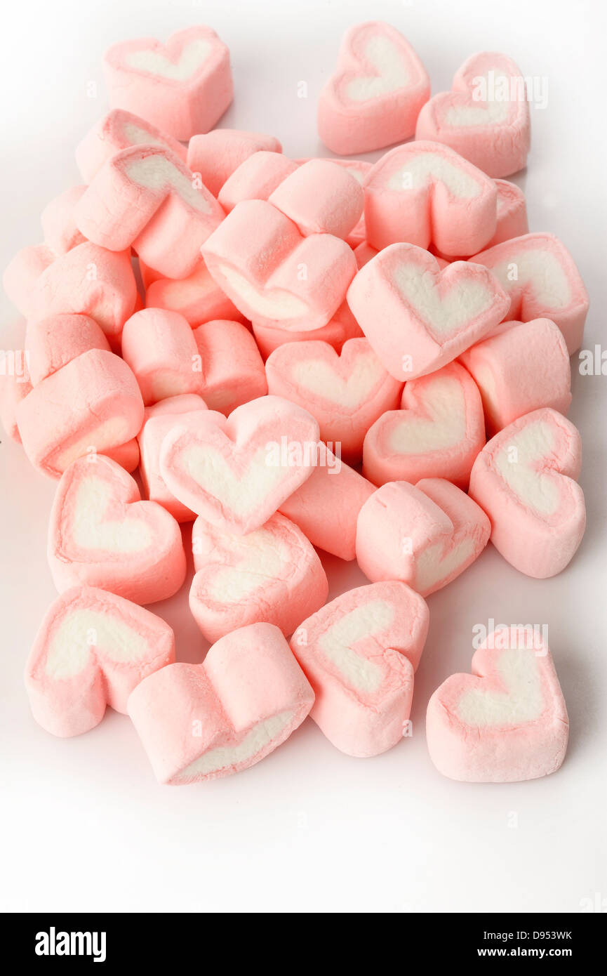 Pink heart shaped marshmallows on white background Stock Photo - Alamy