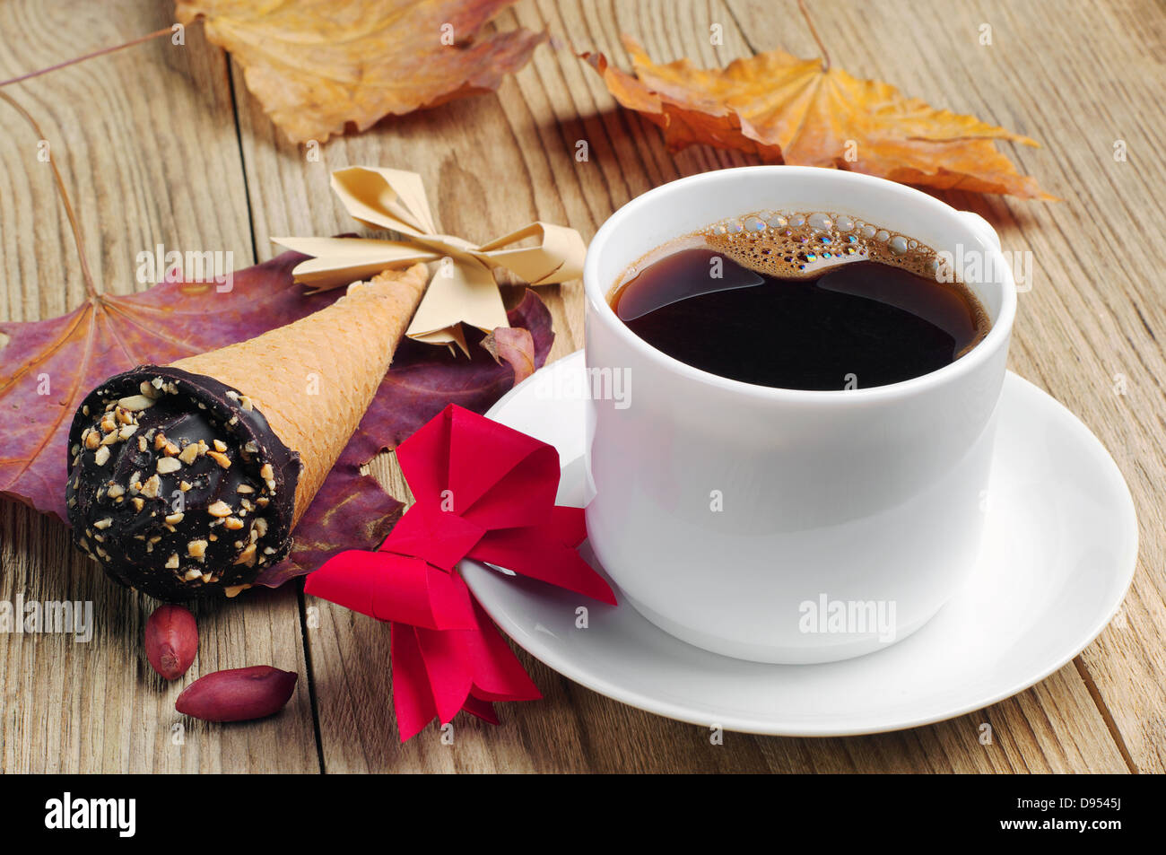 Cup Of Coffee With Cakes In Cream Cone And Bow Out Of Paper Stock Photo Alamy cup-of-coffee-with-cakes-in-cream-cone-and-bow-out-of-paper-stock-photo-alamy