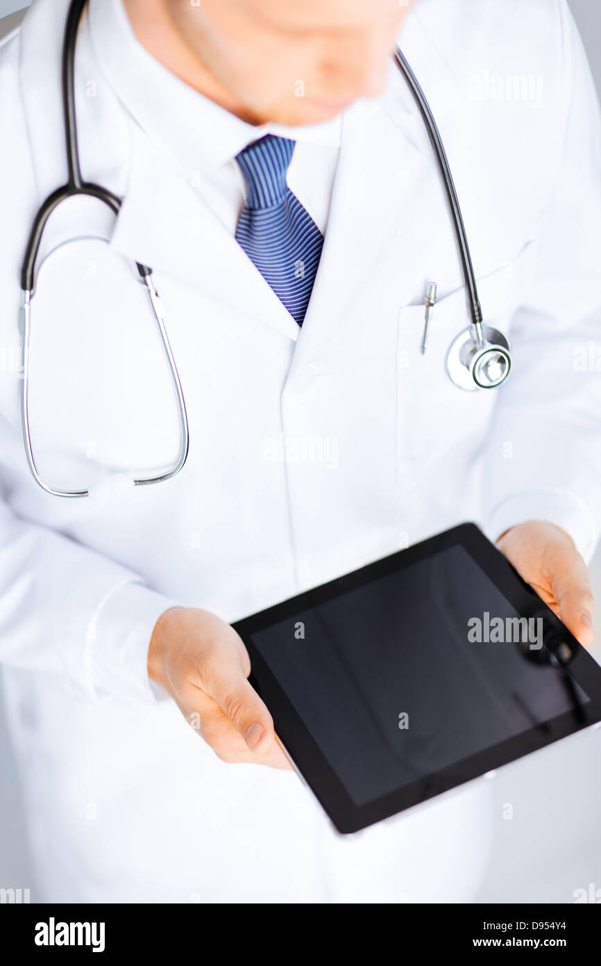 male doctor holding tablet pc Stock Photo - Alamy