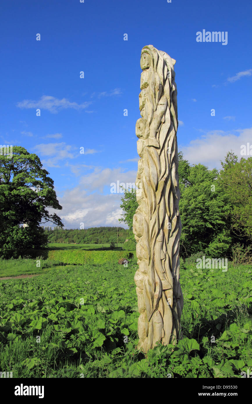 Carved Wooden Totem Pole by the River Annan, Annandale, Dumfries and Galloway, Scotland, UK Stock Photo