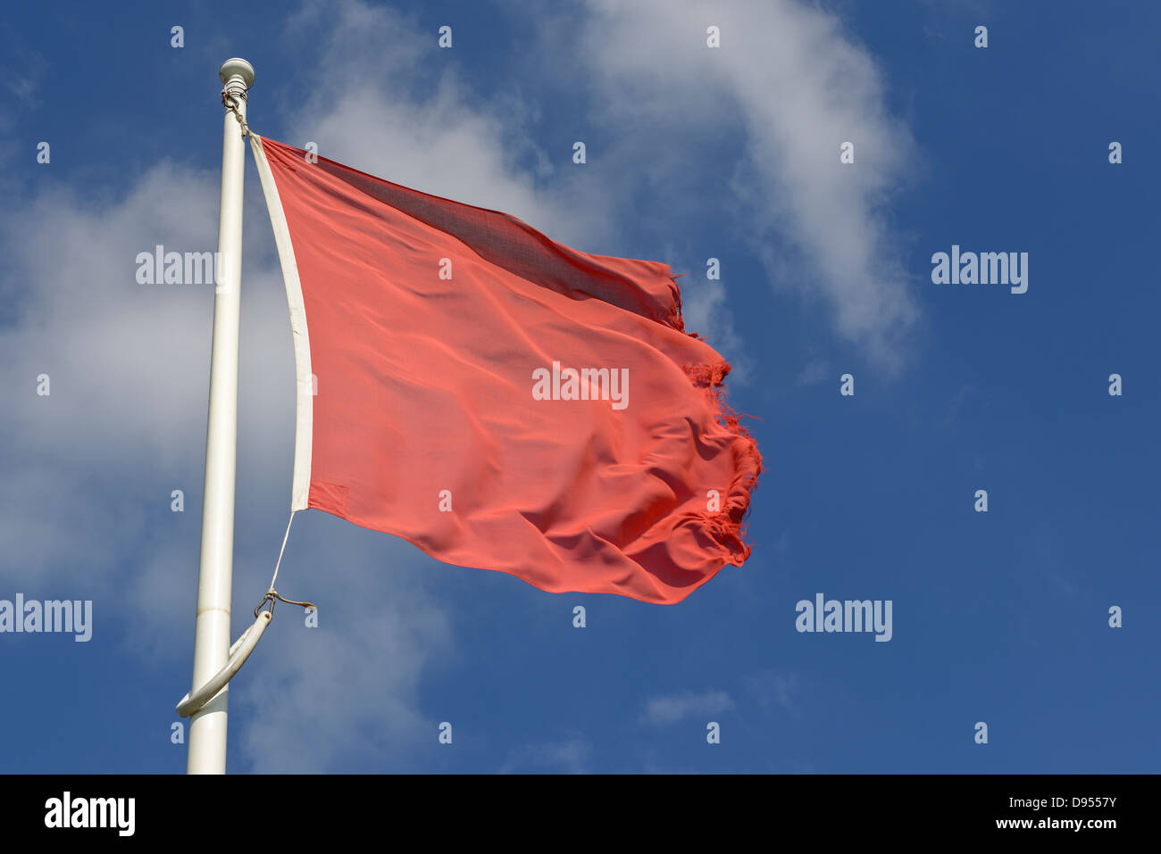 Red flag flying Stock Photo