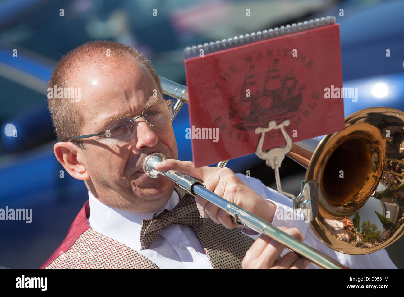 male playing trombone with music sheet Stock Photo
