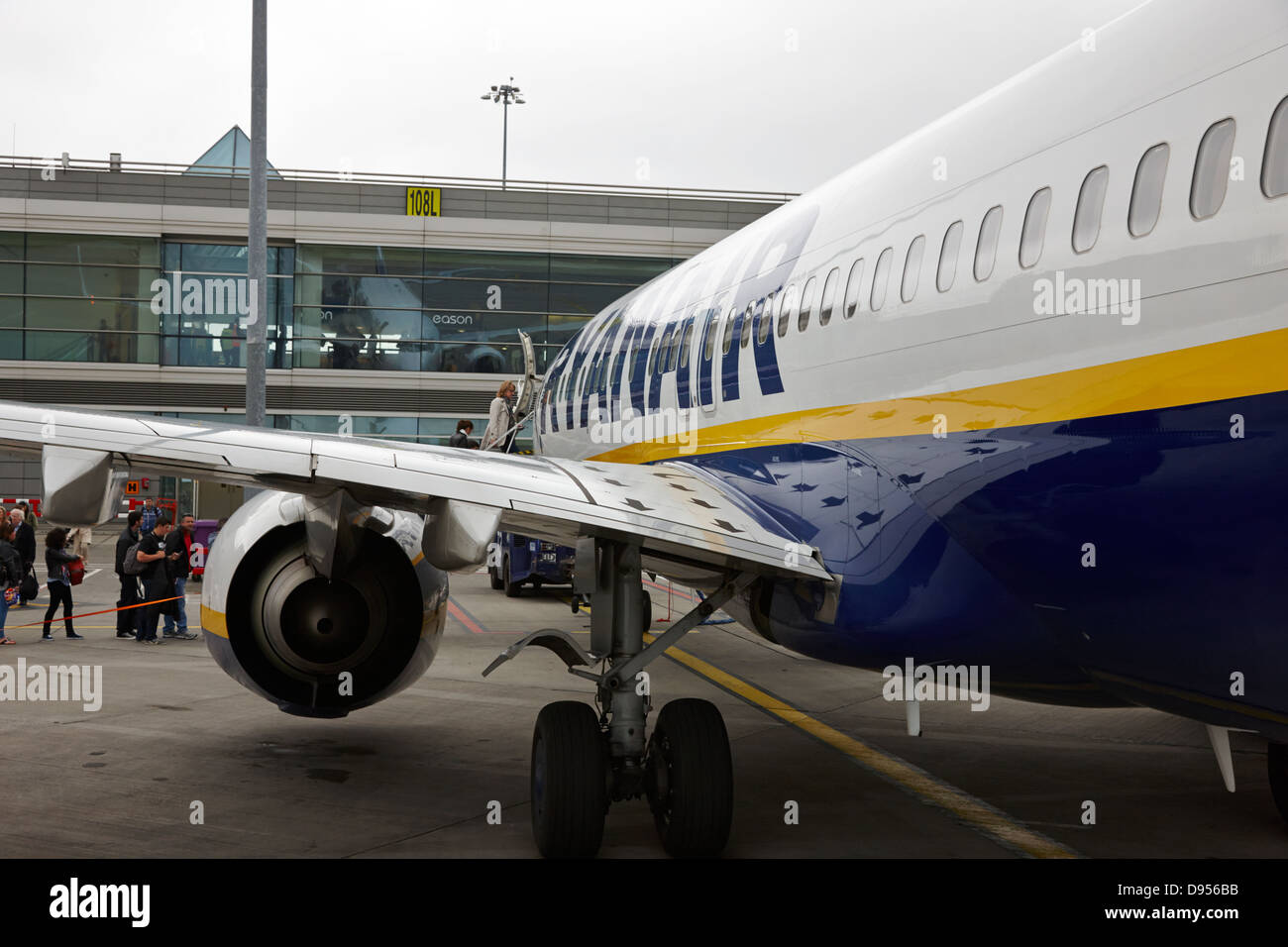 passengers boarding ryanair flight at dublin airport terminal 1 ireland