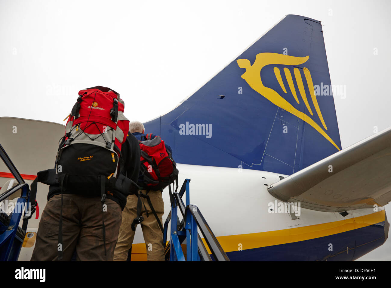 passengers with baggage boarding ryanair flight at dublin airport terminal 1 ireland Stock Photo
