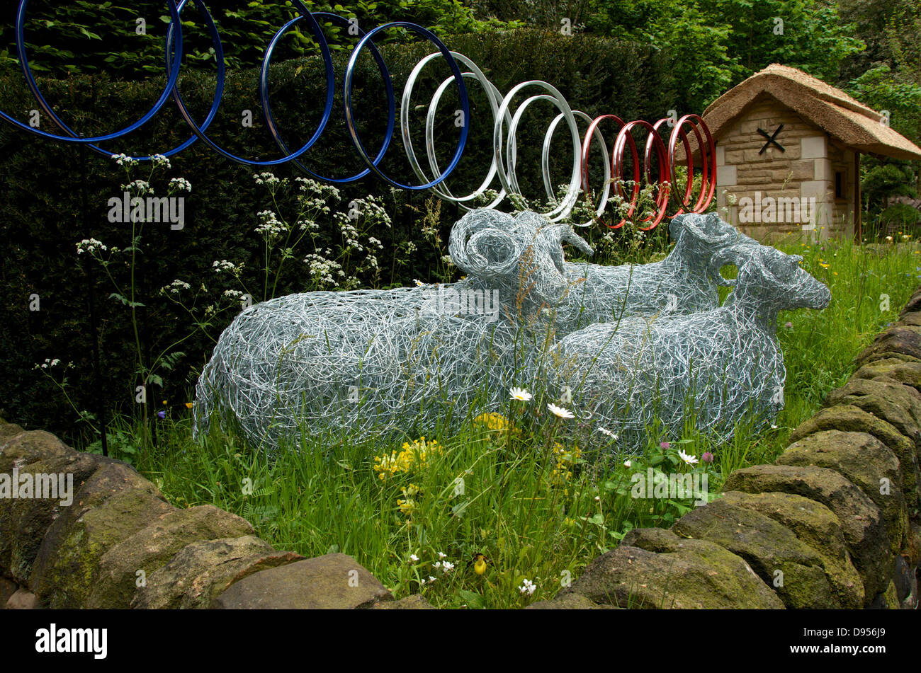 Sheep sculptures in Welcome to Yorkshire Artisan Garden Le Jardin de Yorkshire at RHS Chelsea Flower Show 2013. Stock Photo