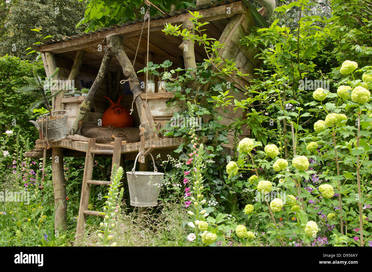 Tree house in the What Will We Leave? NSPCC Garden of Magical Childhood at RHS Chelsea Flower Show 2013, London, UK. Stock Photo