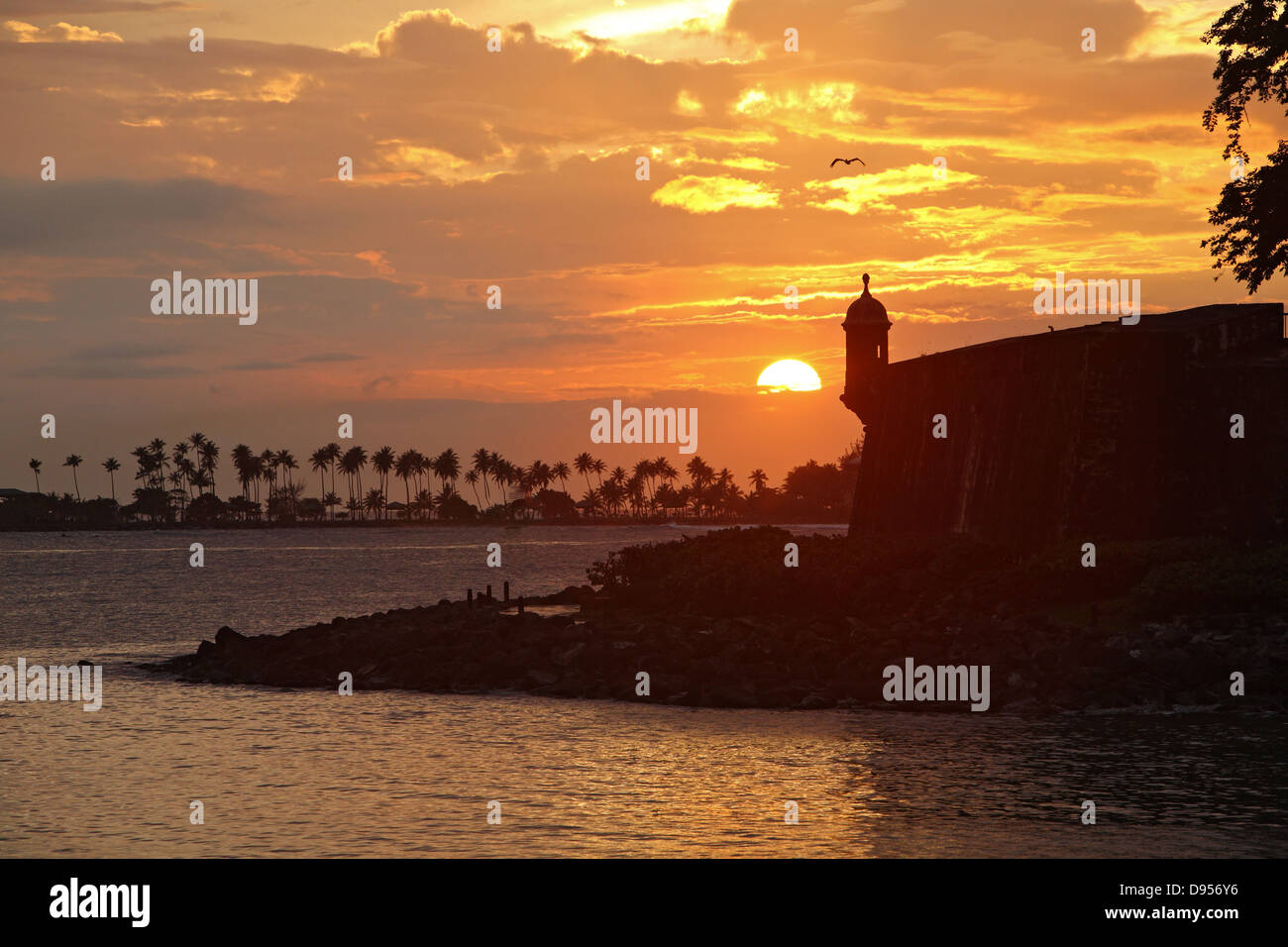 Sun setting over sentry house ('garita') and ramparts, Old San Juan, Puerto Rico Stock Photo