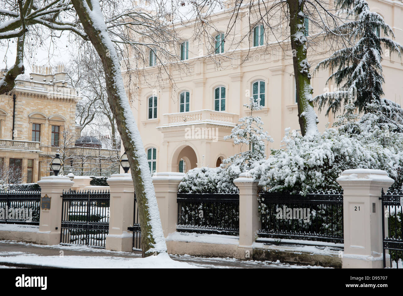 Snow in trees in front of grand mansions in Palace Gate, London, UK Stock Photo