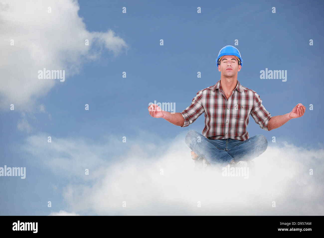 Laborer doing yoga sitting on a cloud Stock Photo Alamy