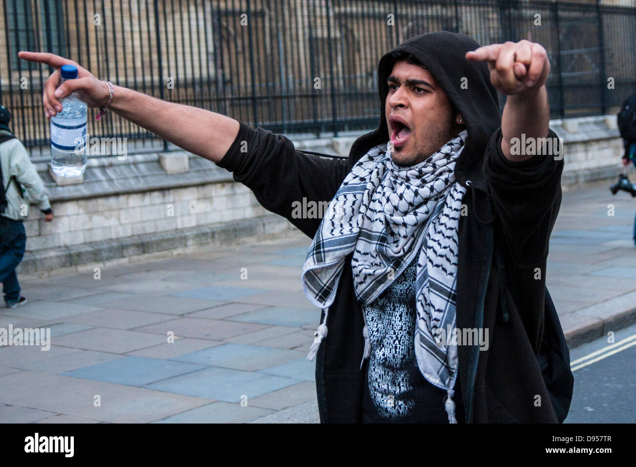 London, UK. 11th June, 2013. An anarchist leads chants during the Stop G8 Day of Action in London. Credit:  Paul Davey/Alamy Live News Stock Photo