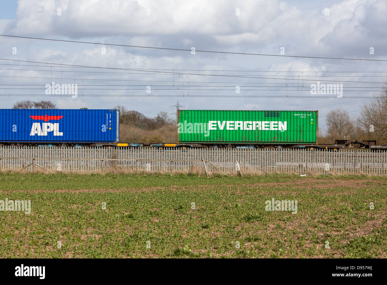 Shipping containers on the railway. Evergreen and APL containers. Stock Photo