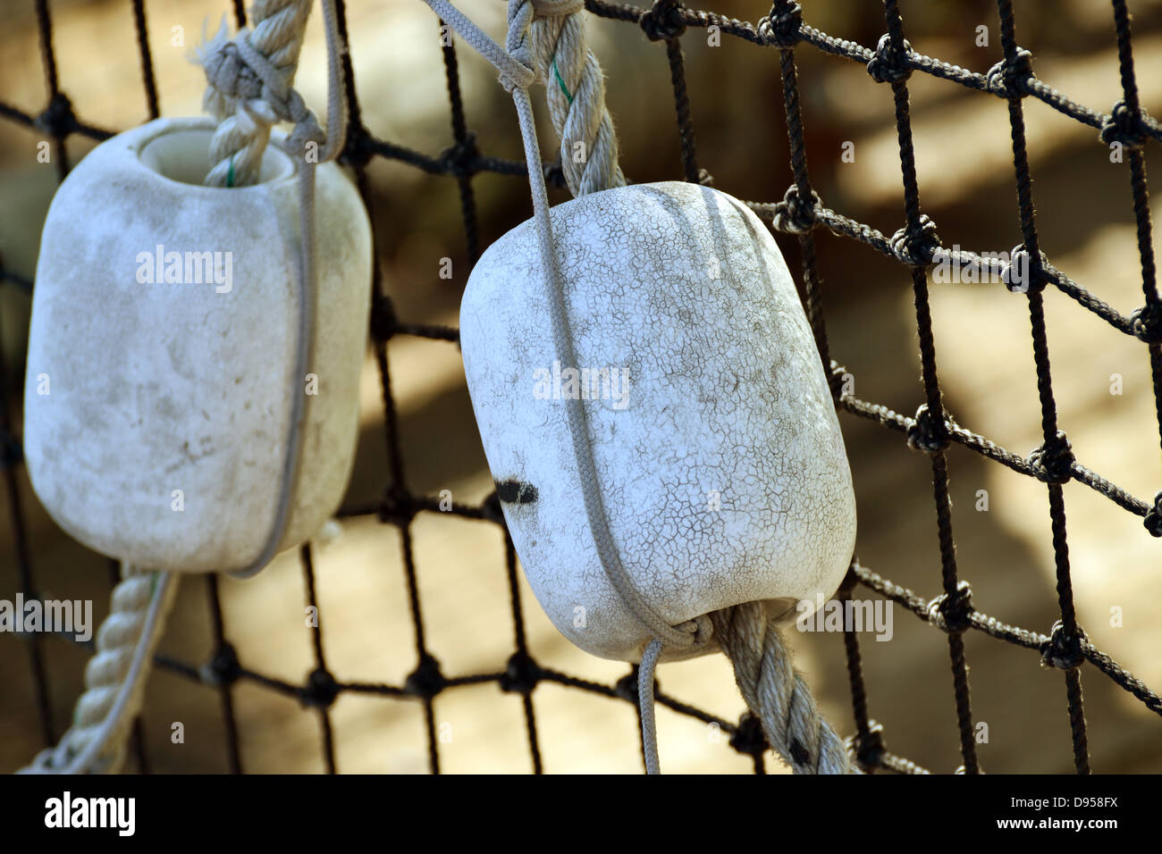 Buoys on a rope and net Stock Photo