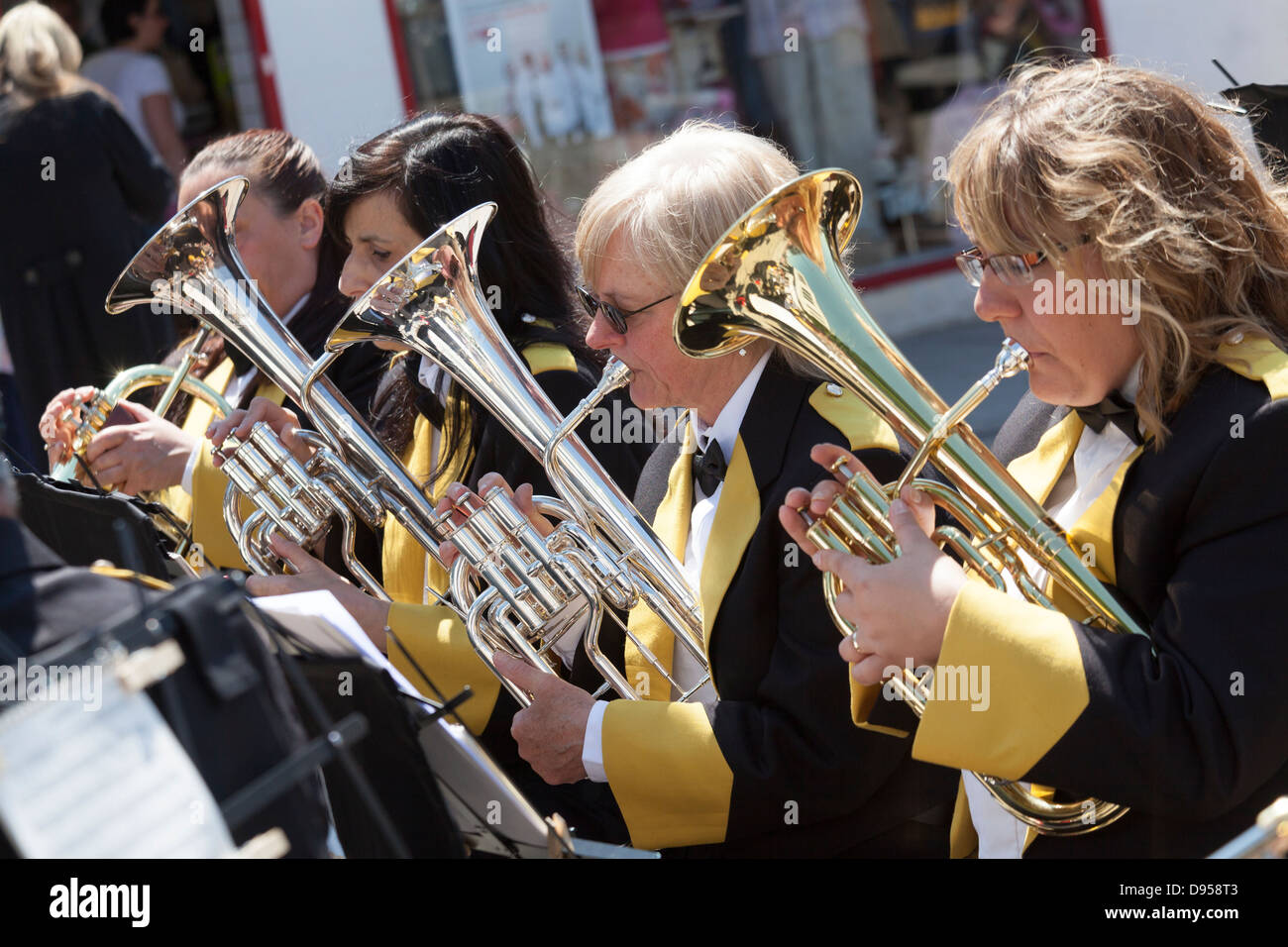 Four women band members playing baritone horns. Stock Photo