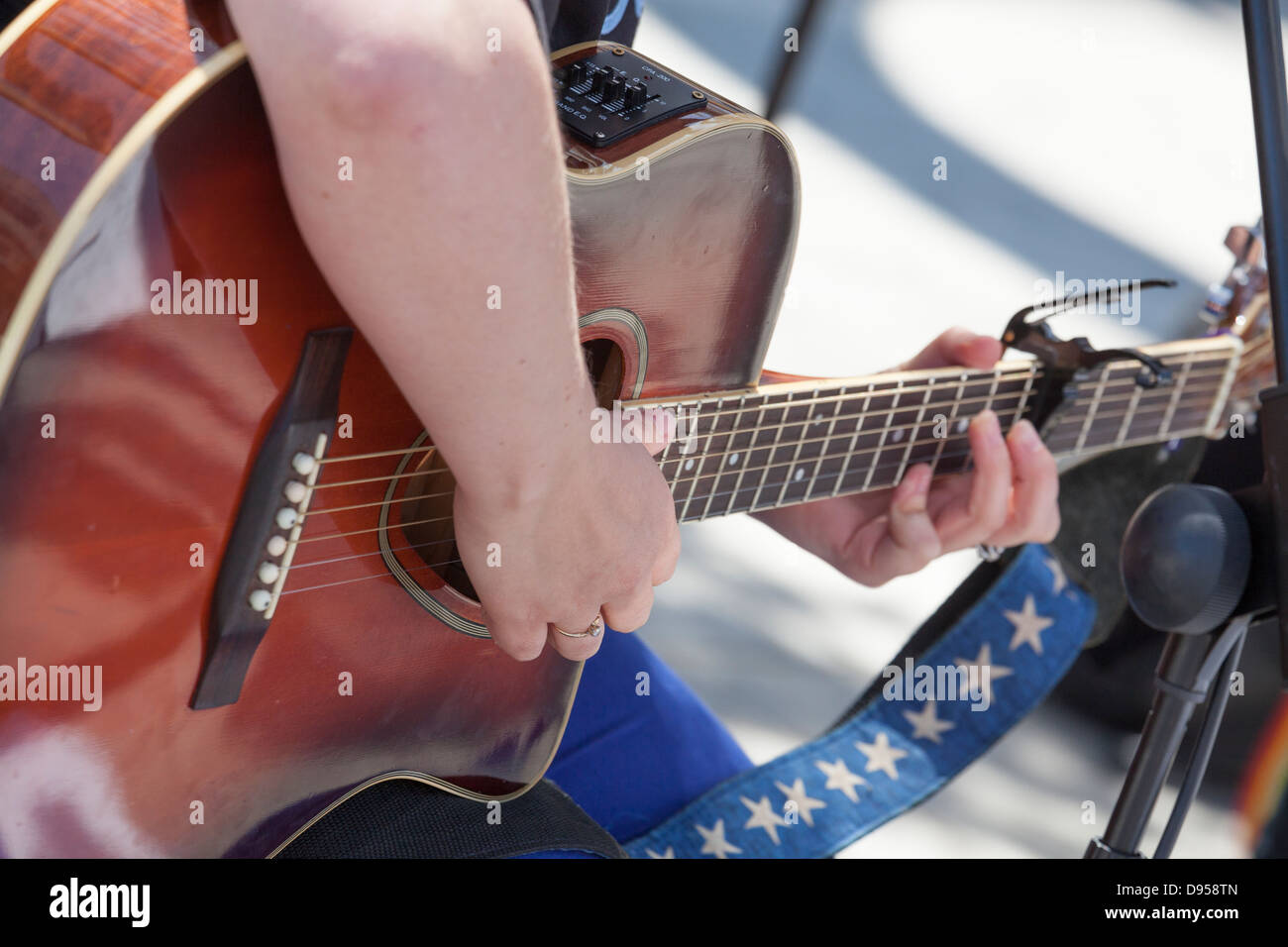 close up of playing guitar and frets Stock Photo