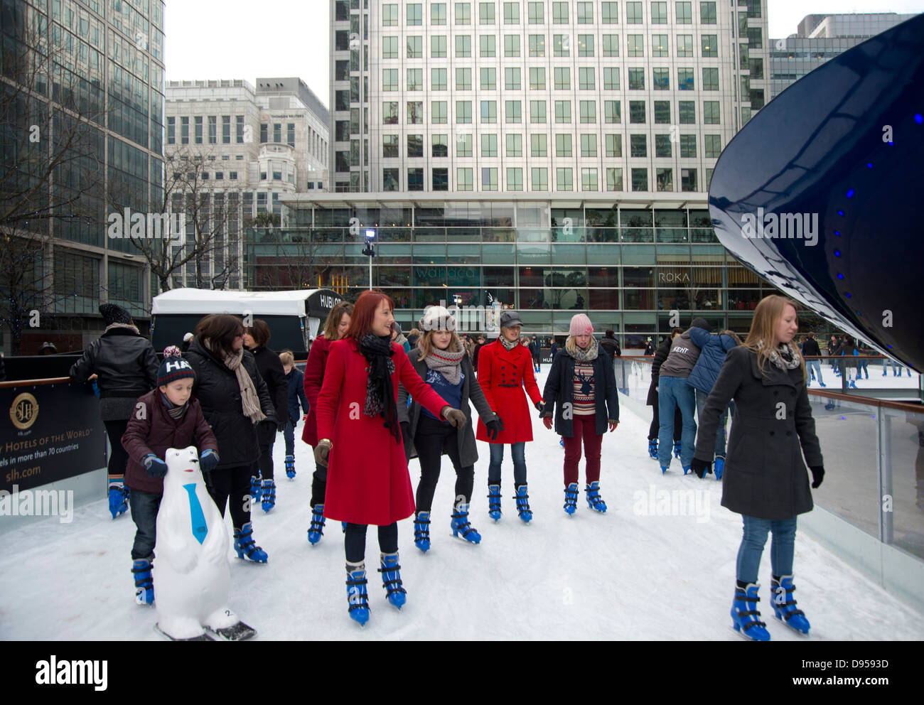 Skaters on the Canary Wharf Ice Rink. Canary Wharf, London, UK Stock