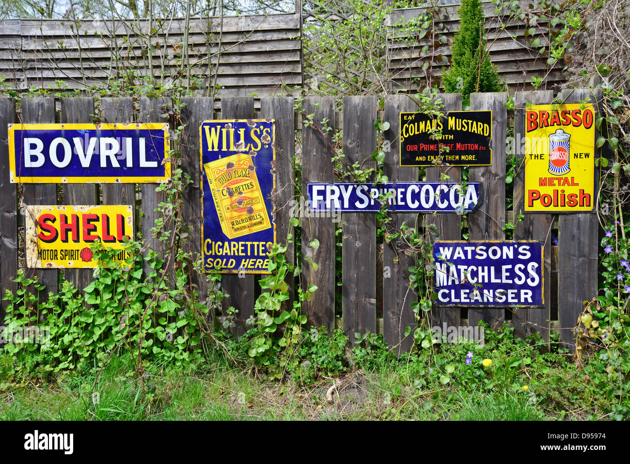 Vintage tin metal signs on fence, Blists Hill Victorian Town, Madeley, Telford, Shropshire, England, United Kingdom Stock Photo