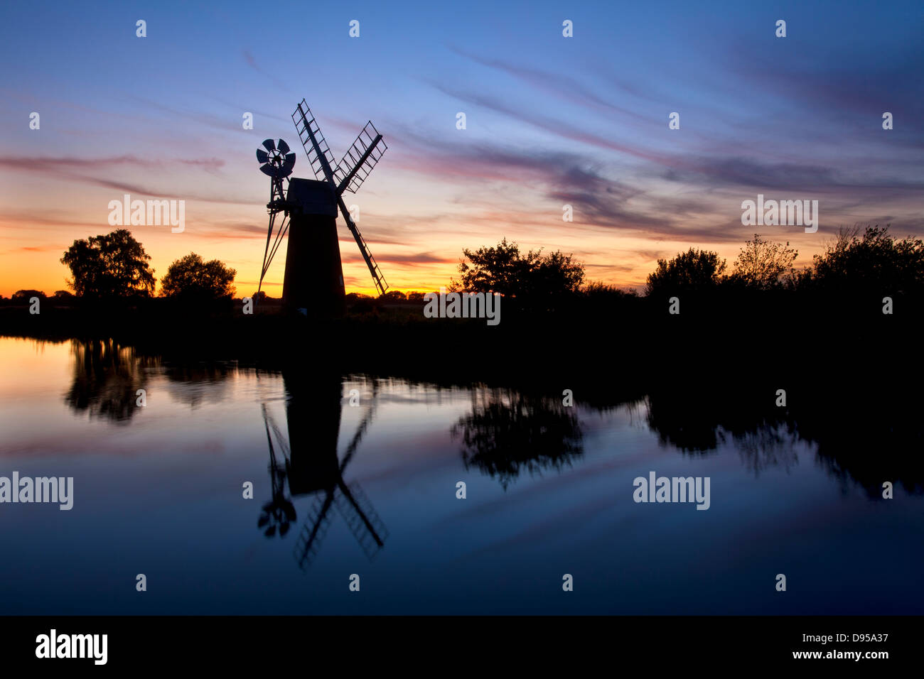 Turf Fen drainage mill at sunset on the River Ant, Norfolk Broads Stock Photo