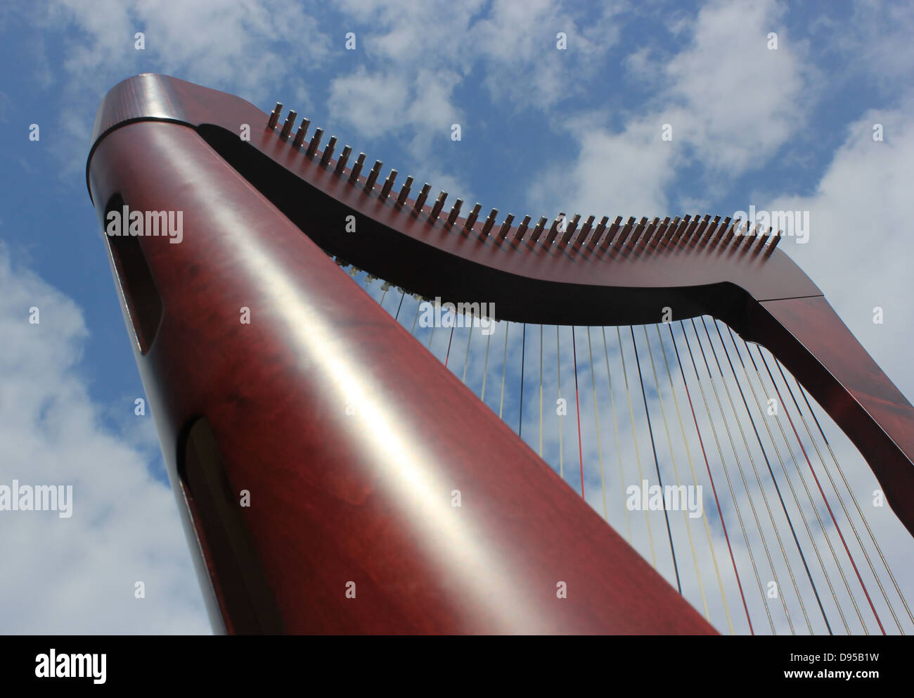 Celtic harp and cloudy sky background Stock Photo