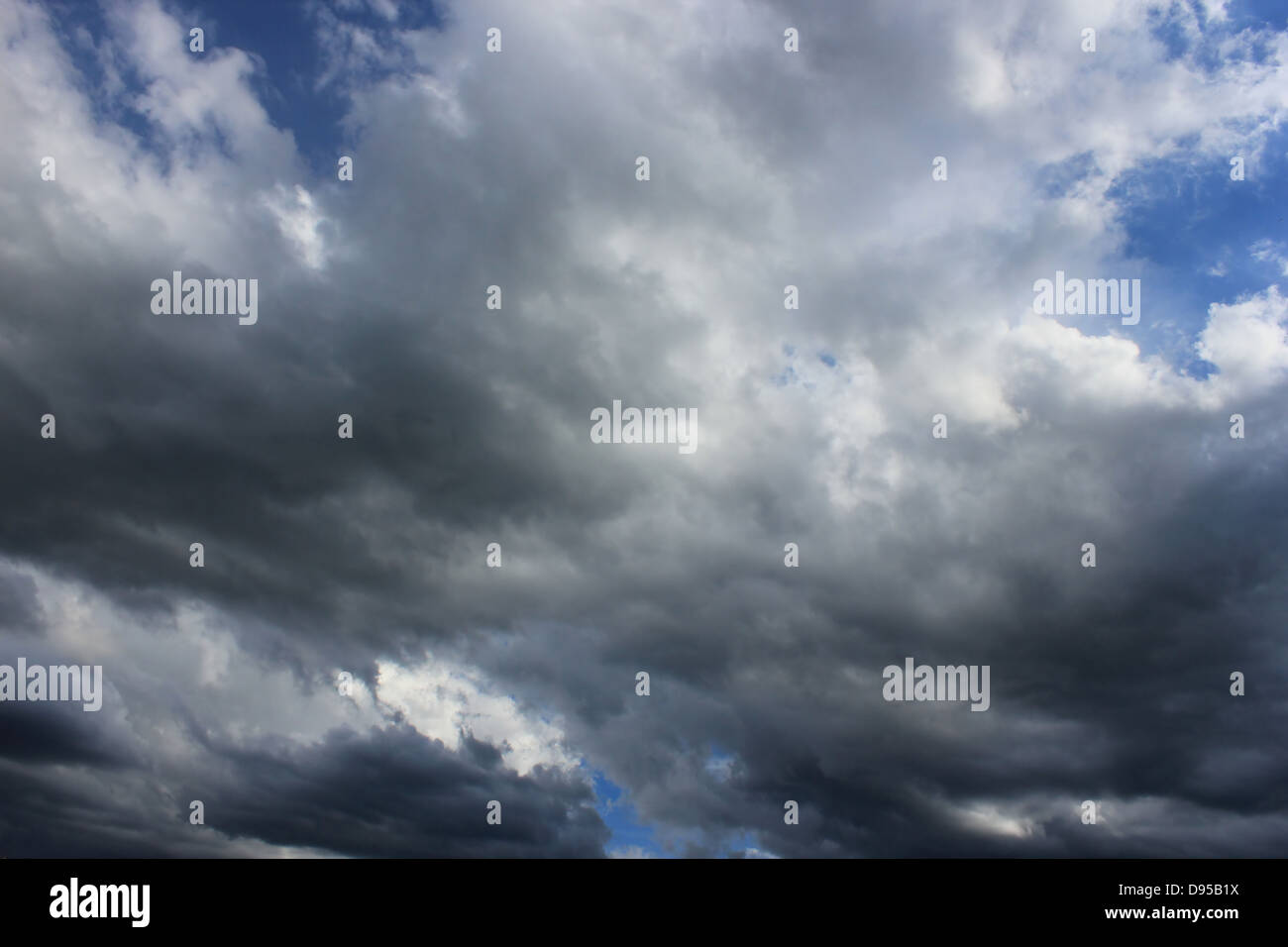 Blue sky filled with dramatic dark-light clouds Stock Photo