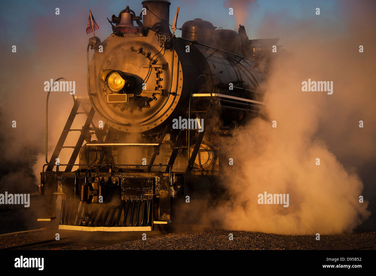 An antique steam engine rolls on the tracks in North Carolina. This steam engine was retired in 1952. Stock Photo