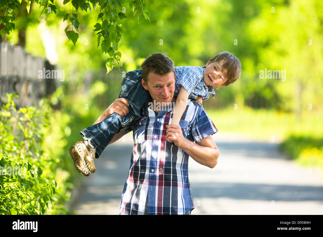 Father and son playing in the park Stock Photo