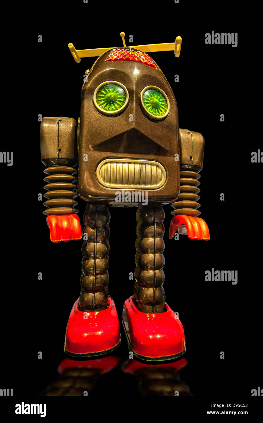 A 1950's metal toy robot knockout image on black background Stock Photo -  Alamy