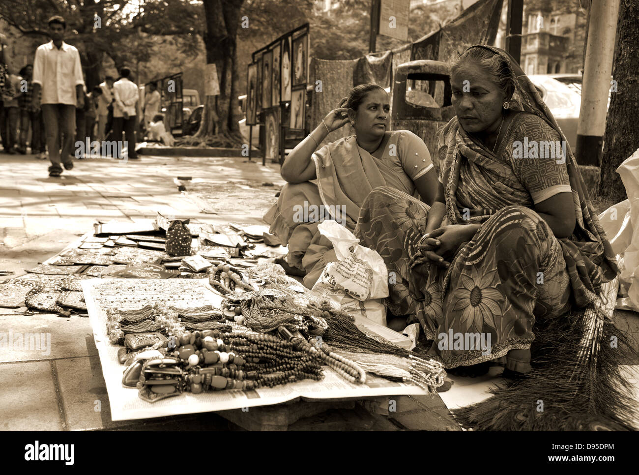 Indian women selling imitation jewelery in a roadside market Stock Photo