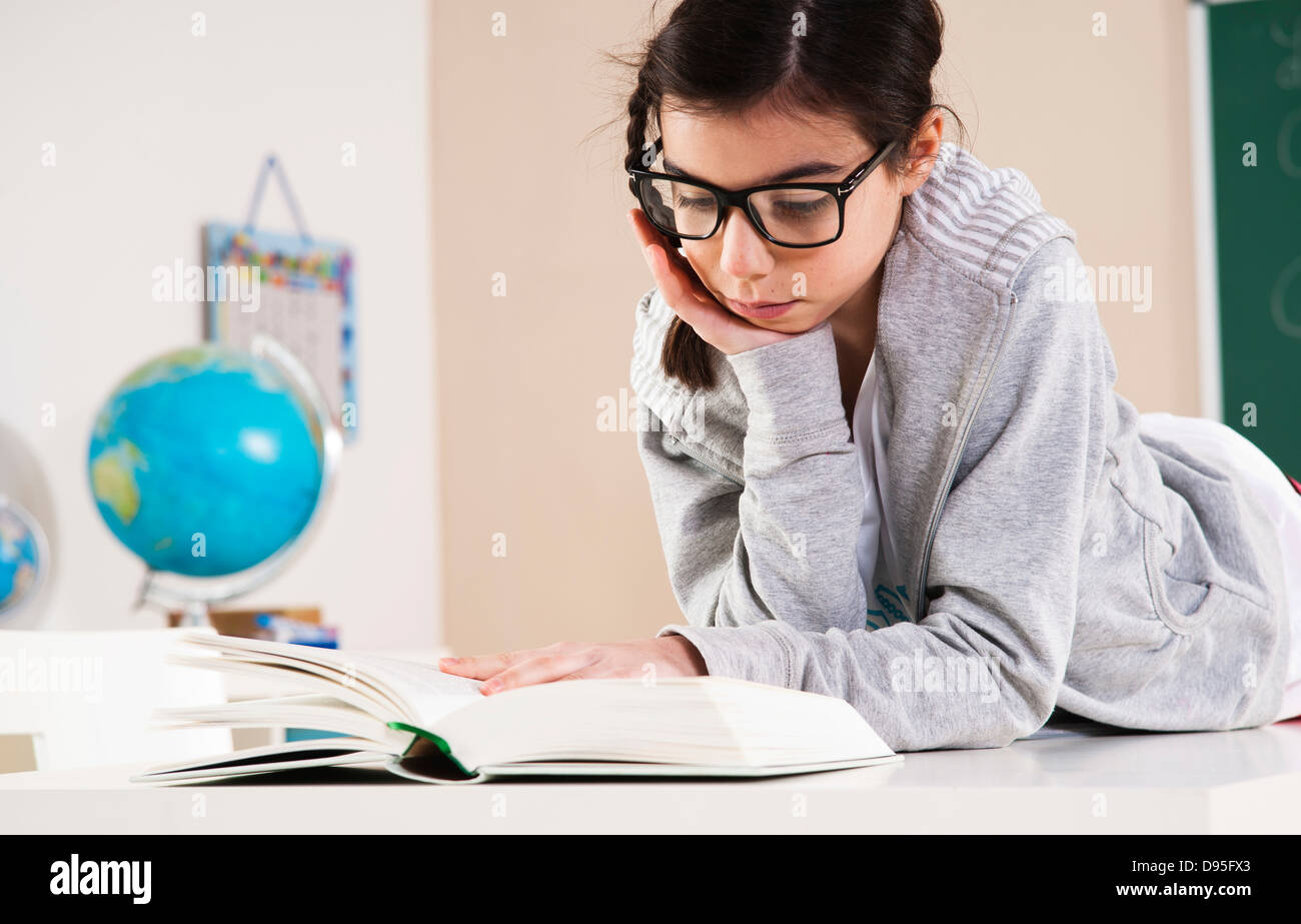 Preteen girl lying on stomach hi-res stock photography and images - Alamy