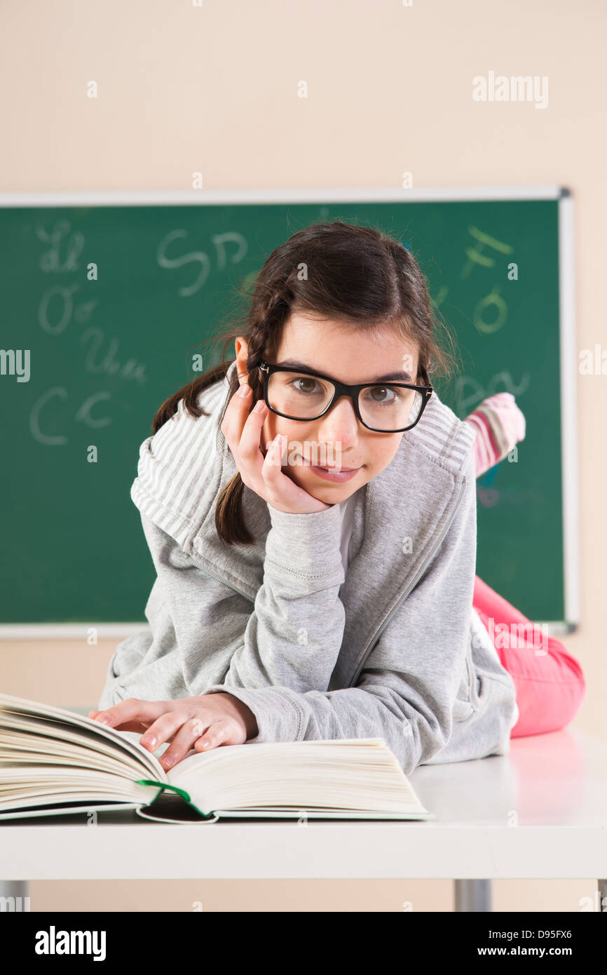 Preteen girl lying on stomach hi-res stock photography and images - Alamy
