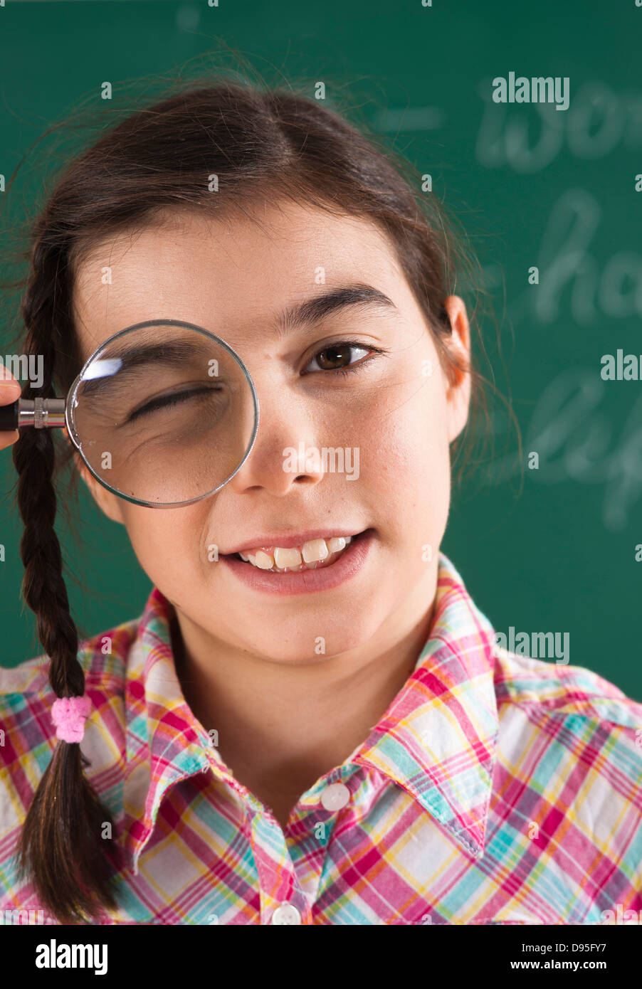 Closeup of Girl with Magnifying Glass in Classroom Stock Photo Alamy