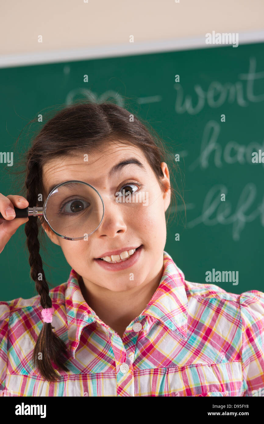 Closeup of Girl with Magnifying Glass in Classroom Stock Photo Alamy