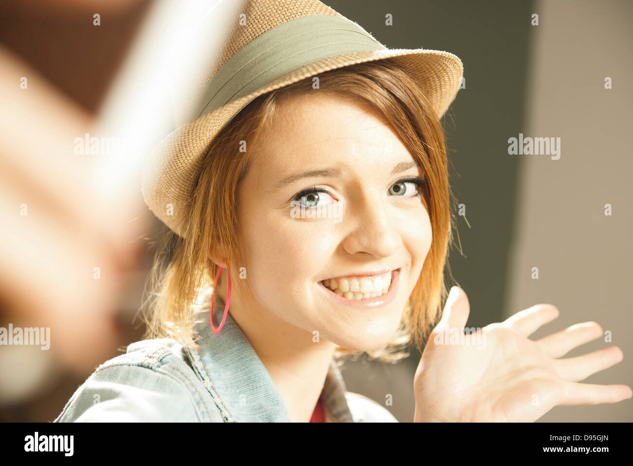 Head and shoulders portrait of teenage girl wearing hat in studio Stock ...
