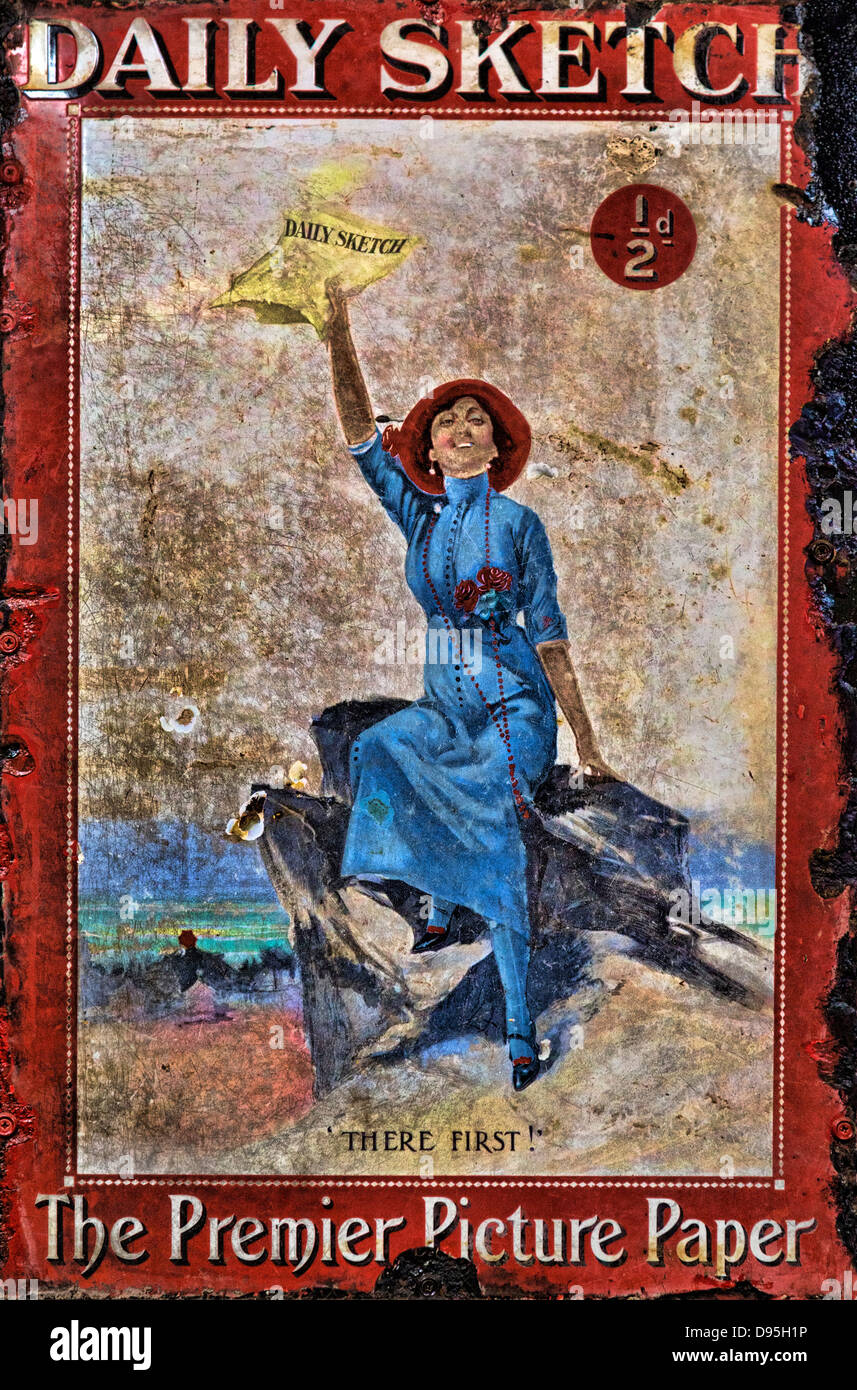 Early 20thC sheet metal enamel sign advertising the Daily Sketch showing a woman holding the paper aloft on a hilltop. Stock Photo