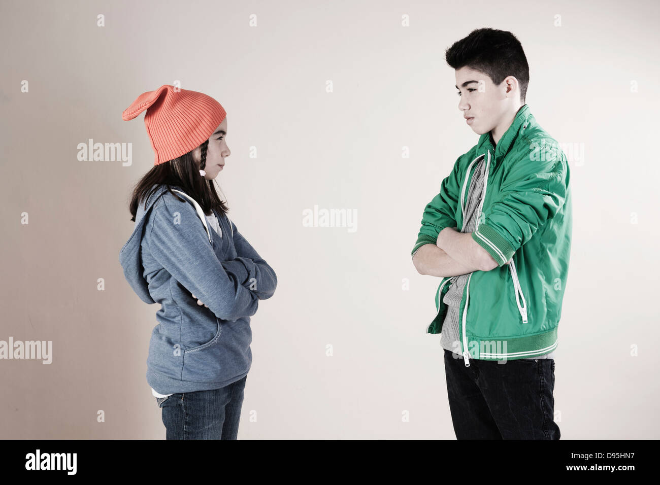 Boy and Girl Arguing in Studio Stock Photo